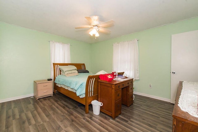 bedroom with dark wood finished floors, baseboards, and a ceiling fan
