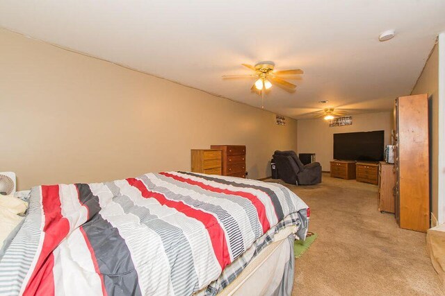 bedroom featuring light colored carpet and ceiling fan