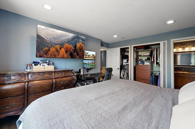 bedroom with recessed lighting, multiple closets, and ensuite bath