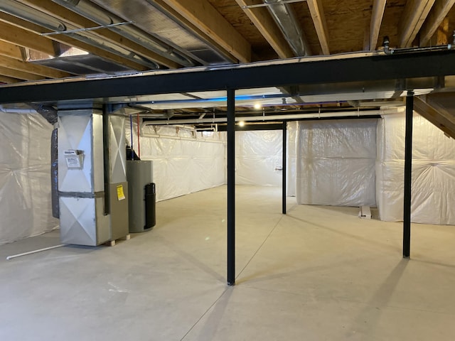 unfinished below grade area with water heater and heating unit