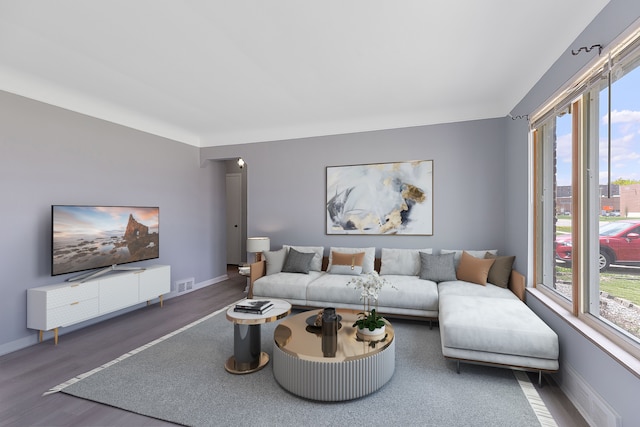 living room with wood finished floors and baseboards