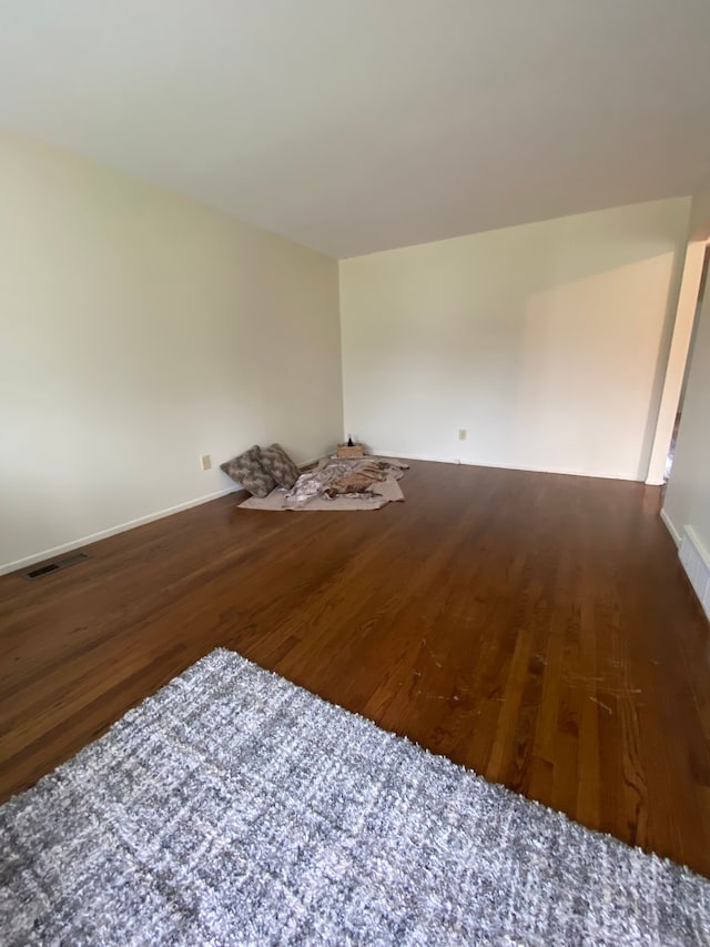 657 Highland Ave, Lincoln Park, MI 48146 - spare room with wood finished floors and baseboards