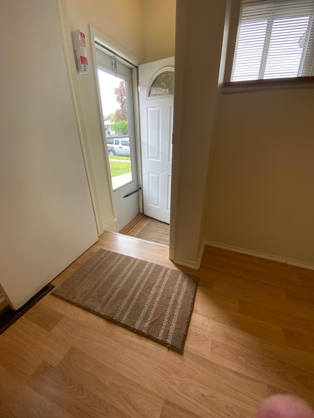 657 Highland Ave, Lincoln Park, MI 48146 - foyer entrance featuring wood finished floors and baseboards
