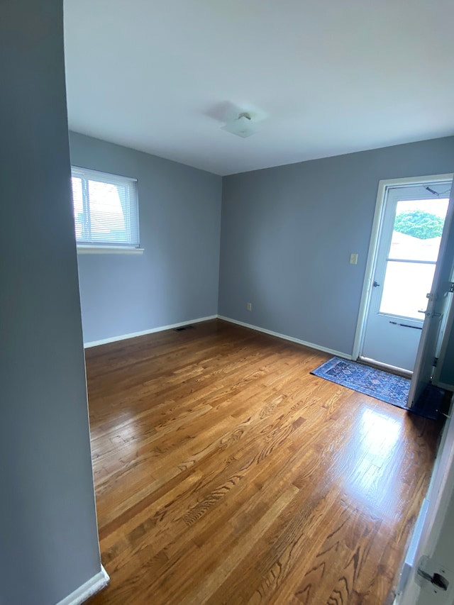 657 Highland Ave, Lincoln Park, MI 48146 - spare room featuring wood finished floors and baseboards