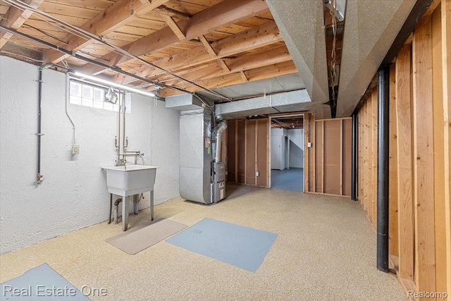 657 Highland Ave, Lincoln Park, MI 48146 - below grade area with heating unit and a sink