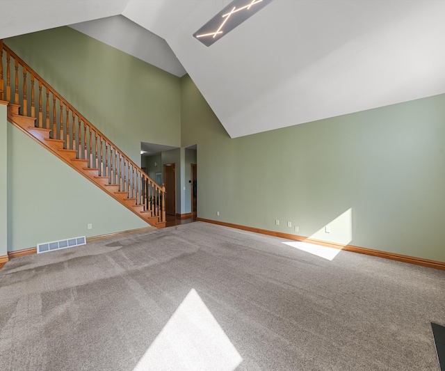 unfurnished living room with stairway, carpet, baseboards, and high vaulted ceiling