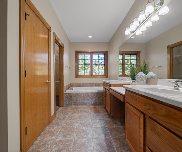 full bathroom featuring a garden tub and double vanity