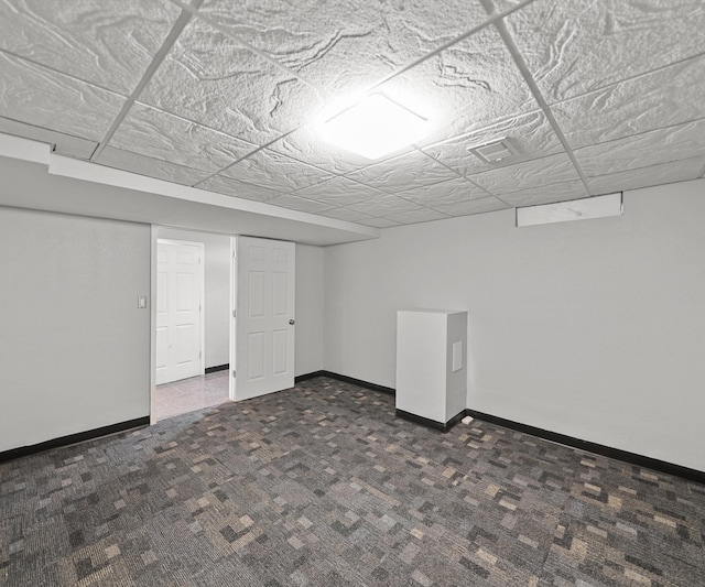 finished basement featuring carpet floors and baseboards