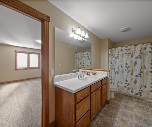 bathroom featuring vanity, toilet, baseboards, and a shower with curtain