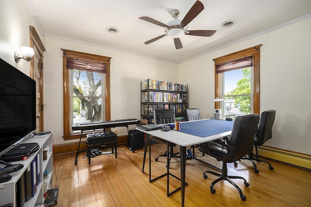 210 E St, Three Rivers, MI 49093 - office space with plenty of natural light, a ceiling fan, ornamental molding, light wood finished floors, and a baseboard radiator