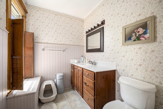 210 E St, Three Rivers, MI 49093 - bathroom with toilet, wallpapered walls, a wainscoted wall, and vanity