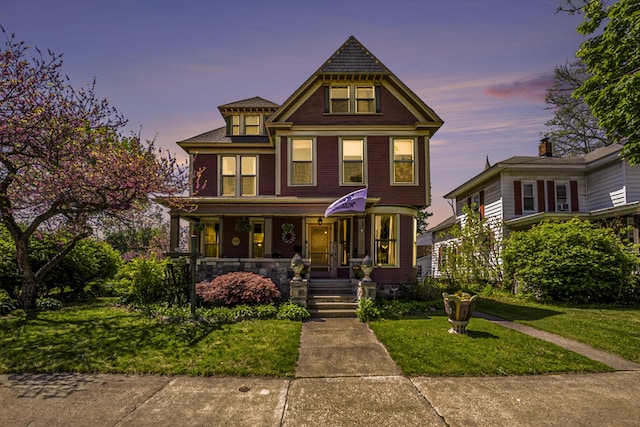 210 E St, Three Rivers, MI 49093 - victorian-style house featuring covered porch and a front yard