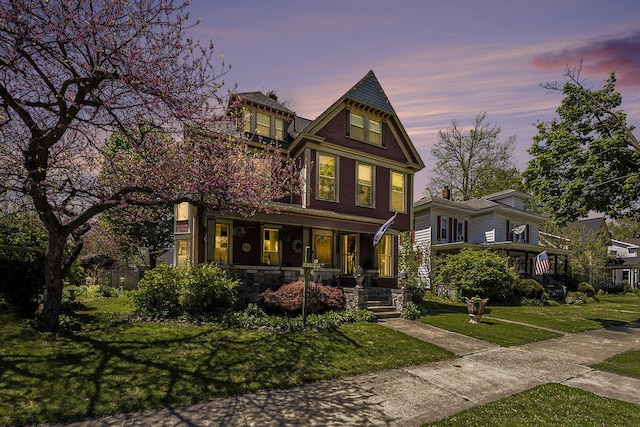 210 E St, Three Rivers, MI 49093 - victorian-style house with covered porch and a front lawn