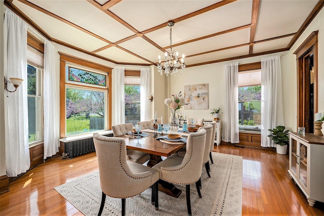 210 E St, Three Rivers, MI 49093 - dining room featuring a chandelier, crown molding, coffered ceiling, and hardwood / wood-style floors