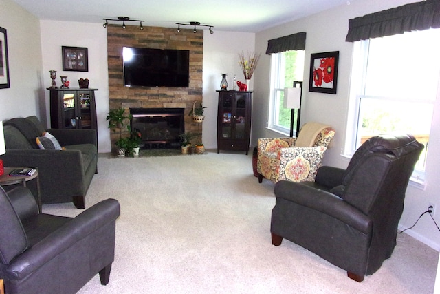 3163 W Ridge Ct, Commerce Twp, MI 48390 - carpeted living room with a fireplace