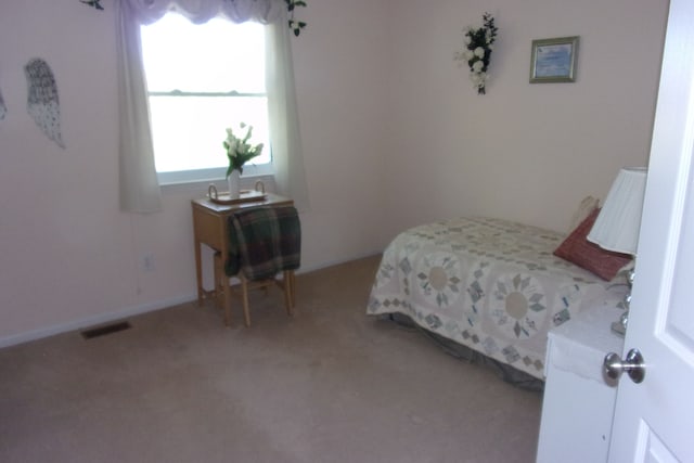 3163 W Ridge Ct, Commerce Twp, MI 48390 - bedroom with light colored carpet