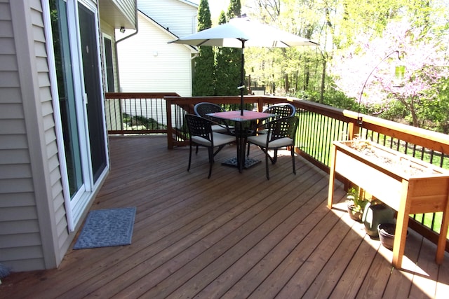 3163 W Ridge Ct, Commerce Twp, MI 48390 - wooden terrace featuring outdoor dining space