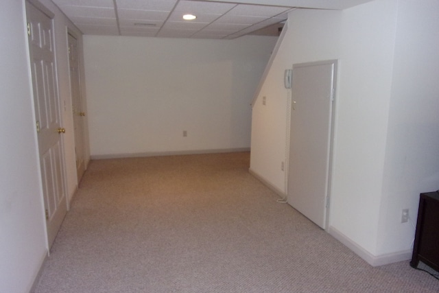 3163 W Ridge Ct, Commerce Twp, MI 48390 - basement with light colored carpet and a drop ceiling