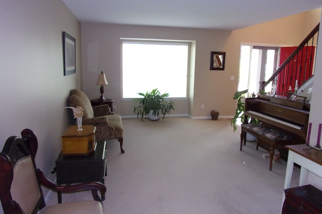 3163 W Ridge Ct, Commerce Twp, MI 48390 - sitting room featuring carpet floors, plenty of natural light, stairs, and baseboards