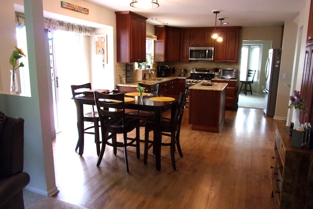 3163 W Ridge Ct, Commerce Twp, MI 48390 - dining room with wood finished floors and plenty of natural light