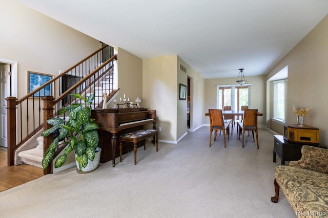 3163 W Ridge Ct, Commerce Twp, MI 48390 - dining area featuring stairway and carpet flooring