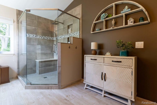 3163 W Ridge Ct, Commerce Twp, MI 48390 - full bath featuring a stall shower, wood finished floors, and lofted ceiling