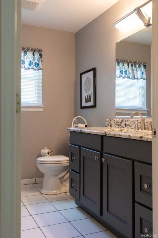 3163 W Ridge Ct, Commerce Twp, MI 48390 - bathroom with vanity and tile patterned floors