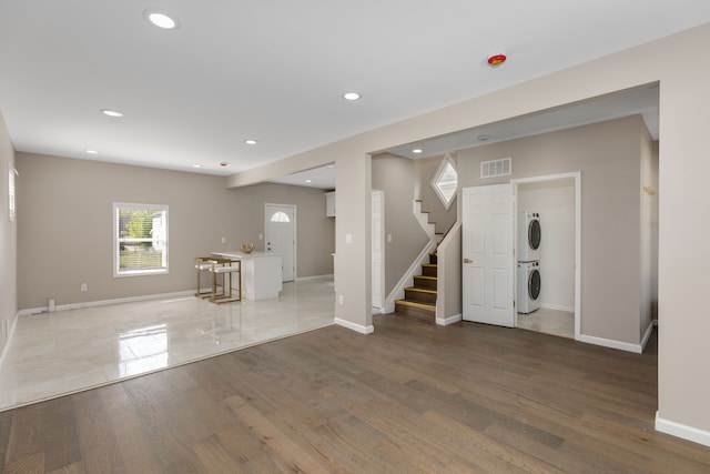 570 King St, Detroit, MI 48202 - foyer entrance featuring stacked washer / dryer, recessed lighting, stairway, baseboards, and wood finished floors