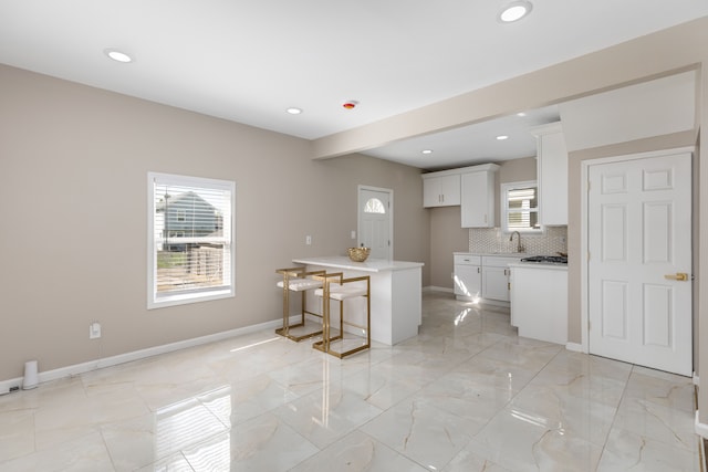 570 King St, Detroit, MI 48202 - kitchen with a sink, light marble finish floors, healthy amount of natural light, and recessed lighting