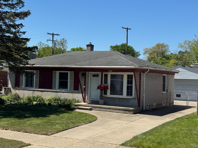 1720 Leslie St, Westland, MI 48186 - view of front of house featuring a front yard, an outbuilding, a chimney, brick siding, and roof with shingles