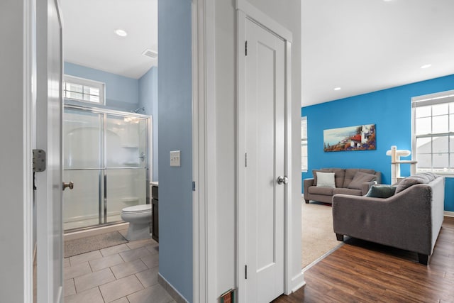 hall featuring recessed lighting