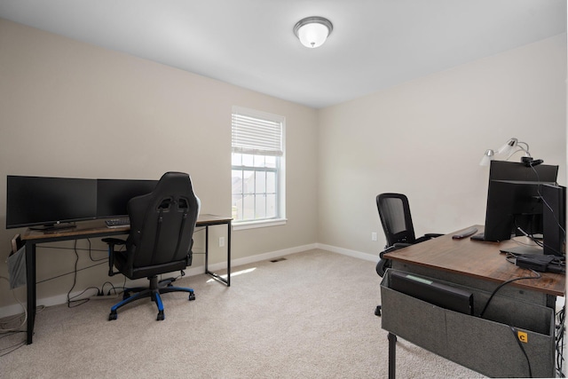 carpeted office with baseboards