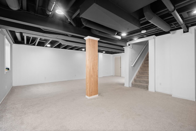finished basement with carpet and stairs