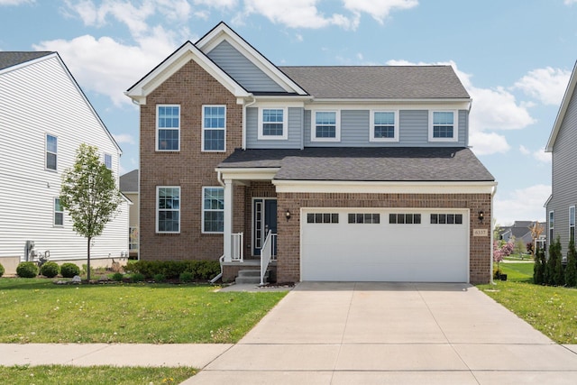 craftsman inspired home featuring brick siding, a front yard, a garage, and concrete driveway