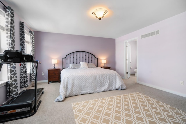 bedroom with carpet flooring and baseboards