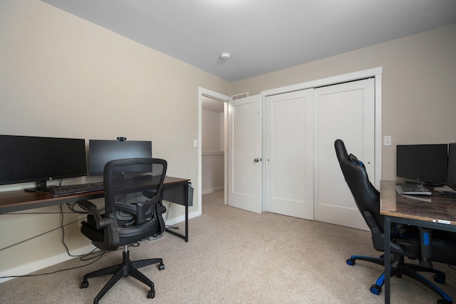 office featuring light colored carpet and baseboards