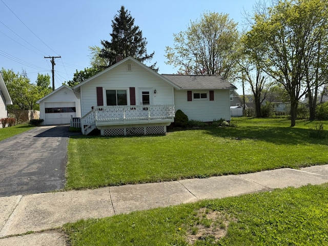 27 Turrill Ave, Lapeer, MI 48446 - view of front of property with a detached garage, an outdoor structure, a wooden deck, and a front yard