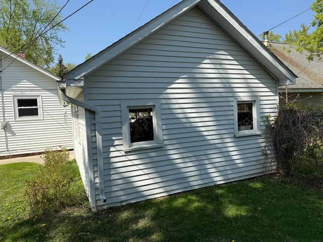 27 Turrill Ave, Lapeer, MI 48446 - view of side of home featuring a lawn