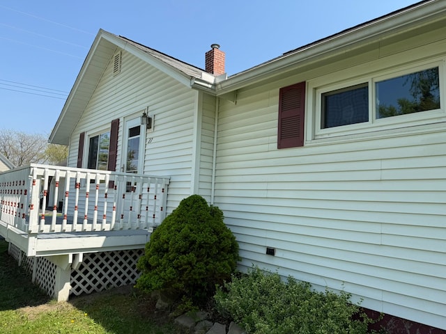 27 Turrill Ave, Lapeer, MI 48446 - rear view of house featuring a chimney and a deck