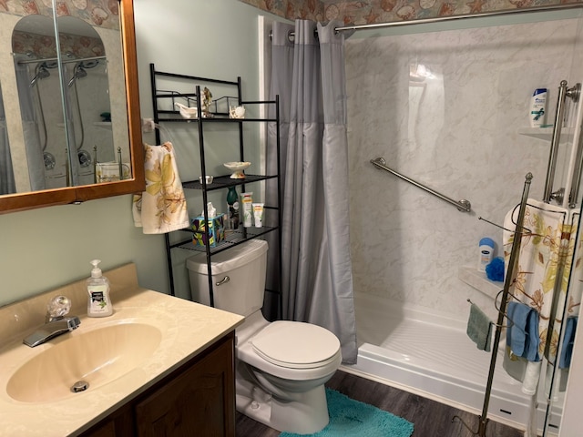27 Turrill Ave, Lapeer, MI 48446 - bathroom featuring a stall shower, toilet, wood finished floors, and vanity