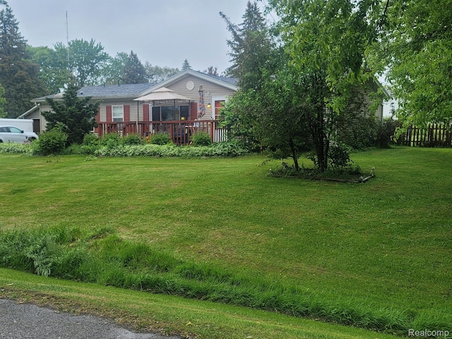 3092 Durant Hts, Grand Blanc, MI 48507 - view of front of home featuring a deck and a front yard