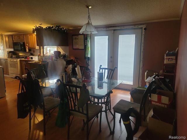 3092 Durant Hts, Grand Blanc, MI 48507 - dining area featuring a textured ceiling and light wood-type flooring