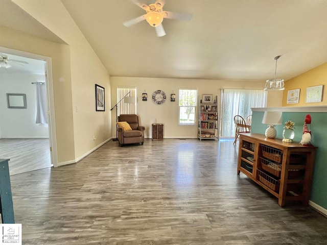 9304 Orchard Ct, Davison, MI 48423 - living area featuring vaulted ceiling, ceiling fan, wood finished floors, and baseboards