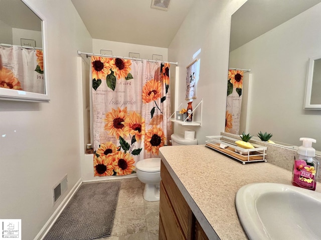 9304 Orchard Ct, Davison, MI 48423 - bathroom featuring toilet, vanity, and shower / tub combo