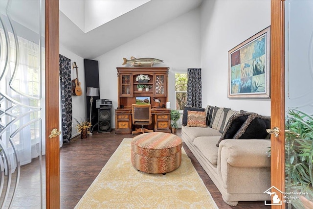 25345 Hunter Ln, Flat Rock, MI 48134 - living area with a desk, high vaulted ceiling, and dark wood-style floors