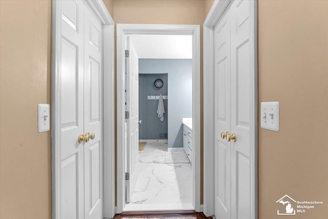 25345 Hunter Ln, Flat Rock, MI 48134 - hallway featuring light marble finish floors and baseboards