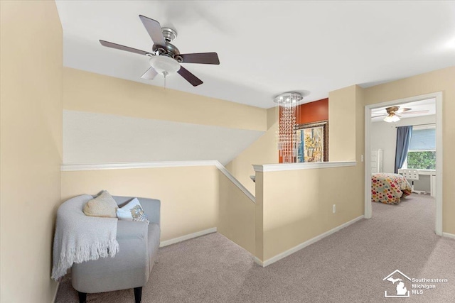25345 Hunter Ln, Flat Rock, MI 48134 - living area with an upstairs landing, carpet, and a ceiling fan