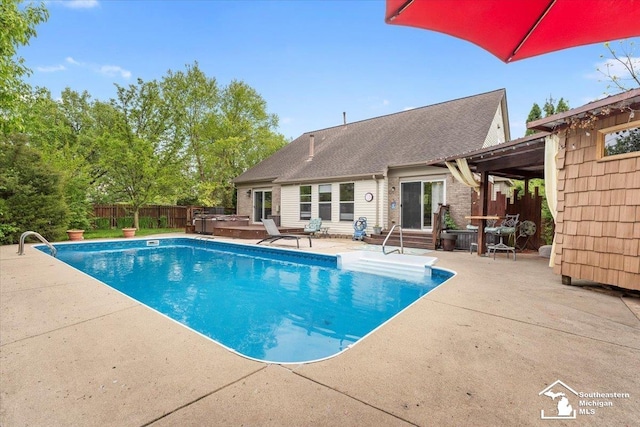 25345 Hunter Ln, Flat Rock, MI 48134 - view of pool featuring a jacuzzi, a patio area, a fenced backyard, and entry steps