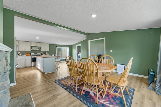 3311 5 Mile Rd, Sears, MI 49679 - dining room with light wood-style floors, a textured ceiling, baseboards, and recessed lighting