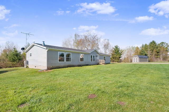 3311 5 Mile Rd, Sears, MI 49679 - rear view of house featuring a shed, an outbuilding, a yard, and crawl space